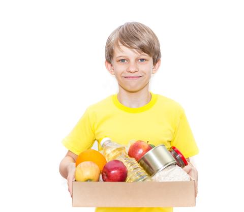 child with box of food for harvest